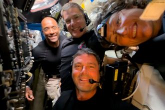 Midway through their lunar observation period on April 6, 2026, the Artemis II crew members, NASA astronauts Reid Wiseman, Victor Glover, Christina Koch, and CSA (Canadian Space Agency) astronaut Jeremy Hansen, pause to turn the camera around for a selfie inside the Orion spacecraft. Credit: NASA